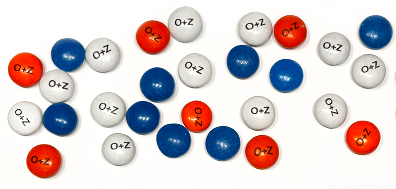O+Z's annual holiday card includes candy in corporate colors with logo imprinted.